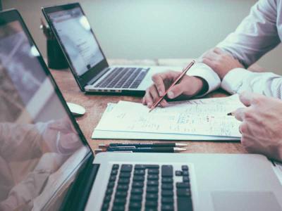 Two people discussing a document. 