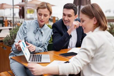 Group of people consulting while viewing computer content