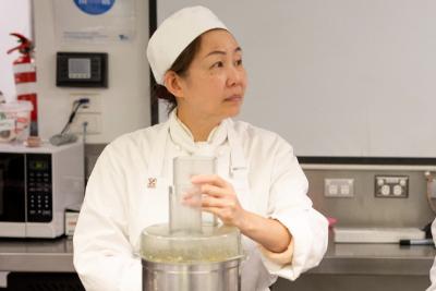Baker at work in kitchen making bread