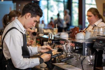 Hospitality barista making coffee